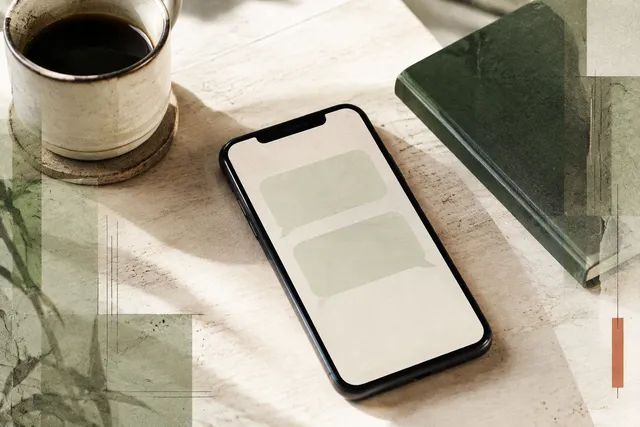 A phone with two empty message bubbles beside a coffee and green notebook, in an ivory paper collage.